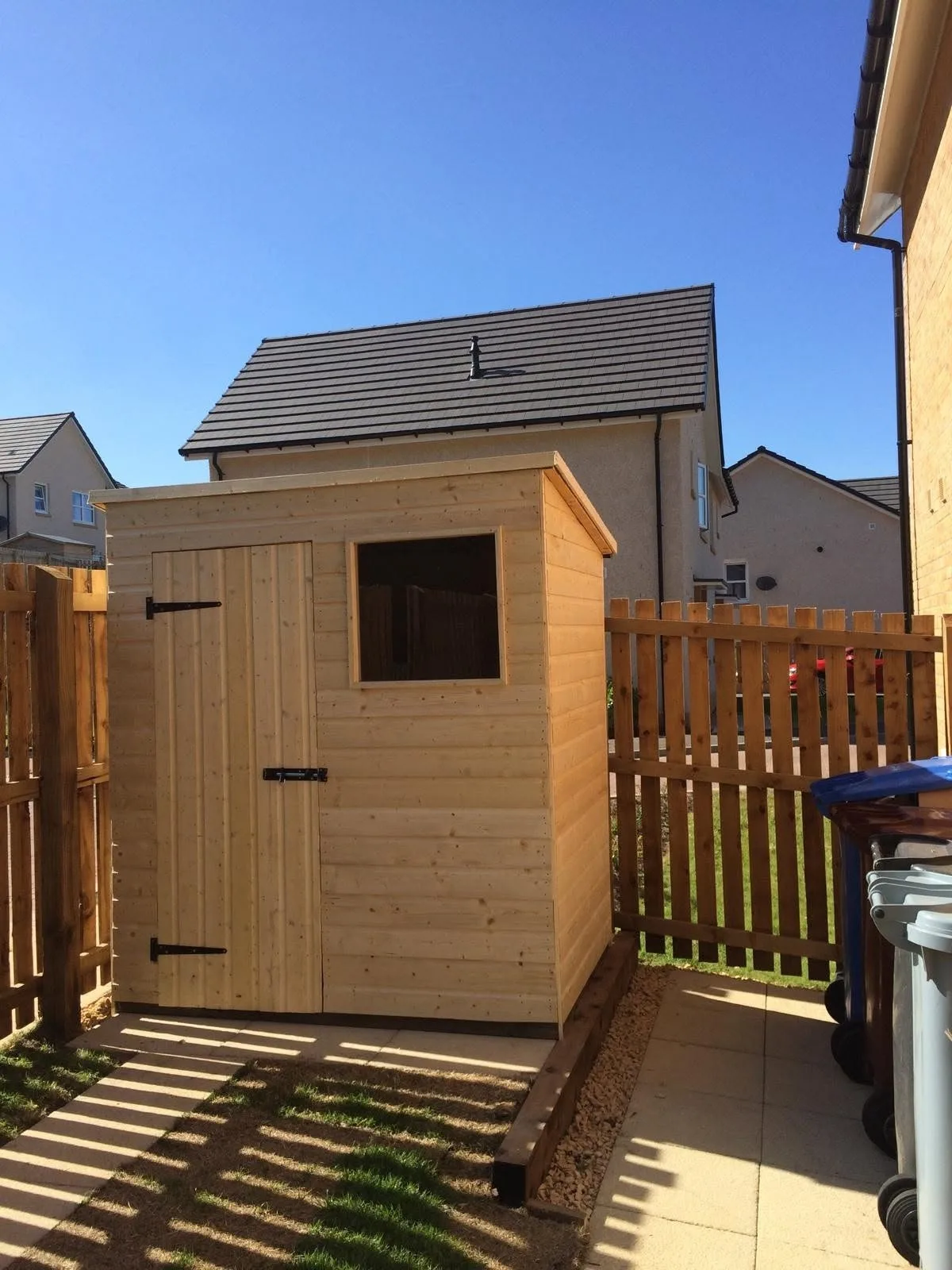Compact pent-roof timber garden shed with window