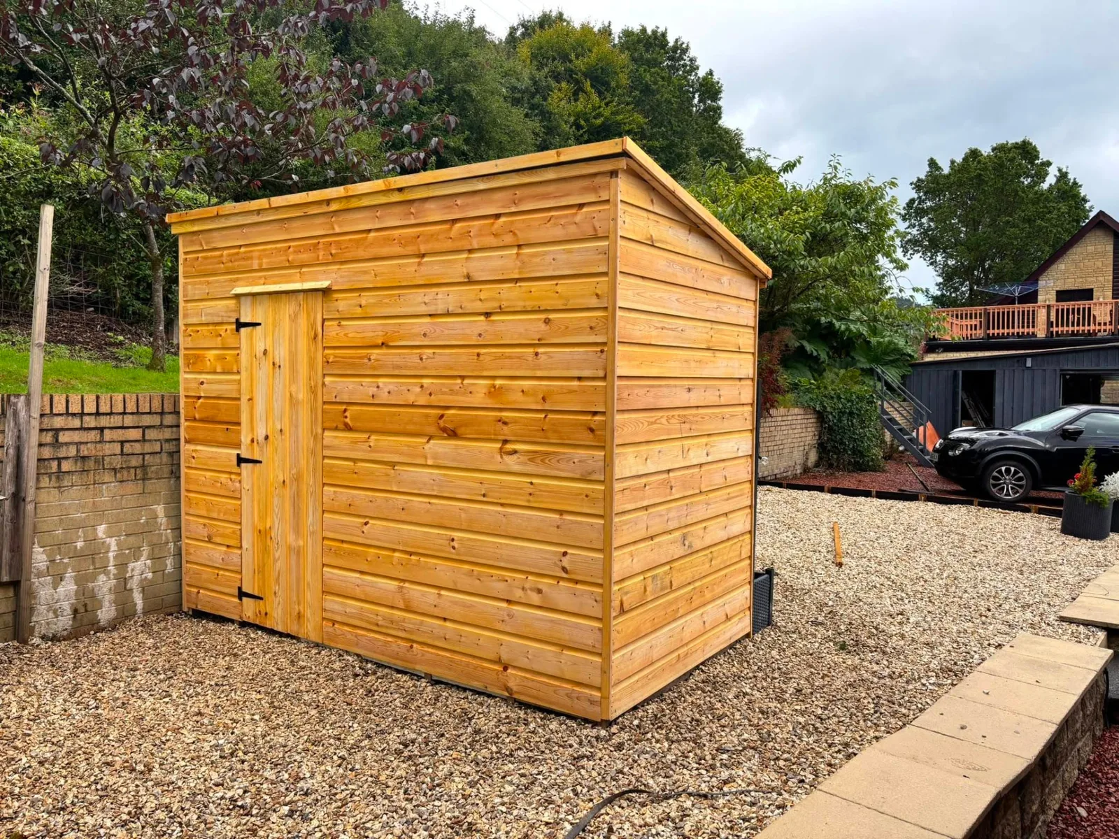 Traditional timber garden shed on a gravel base