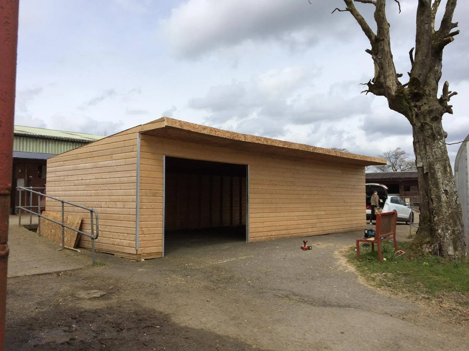 Large bespoke timber outdoor building with wide open entrance